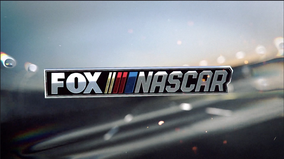 Fox NASCAR chrome badge on a rain-flecked track